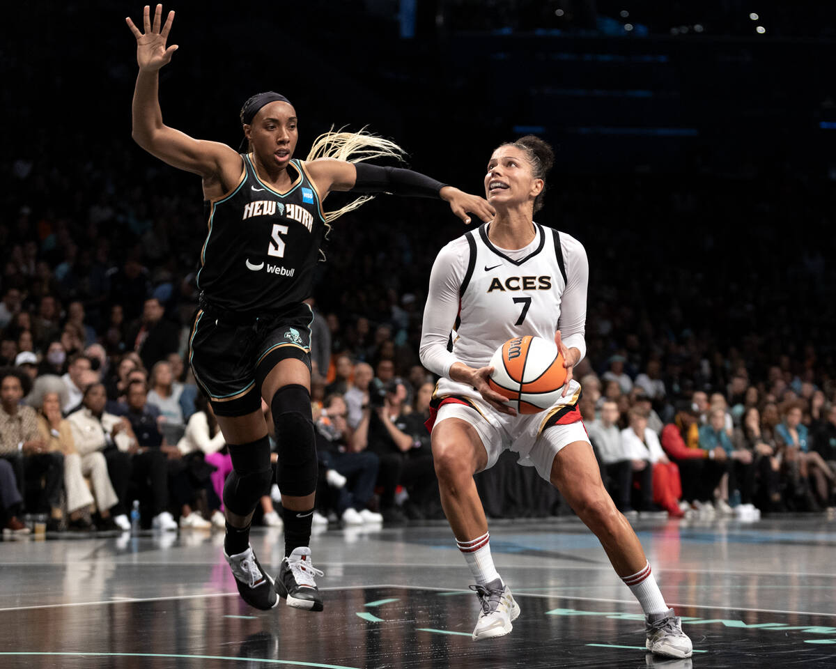 Las Vegas Aces forward Alysha Clark (7) moves to shoot against New York Liberty forward Kayla T ...