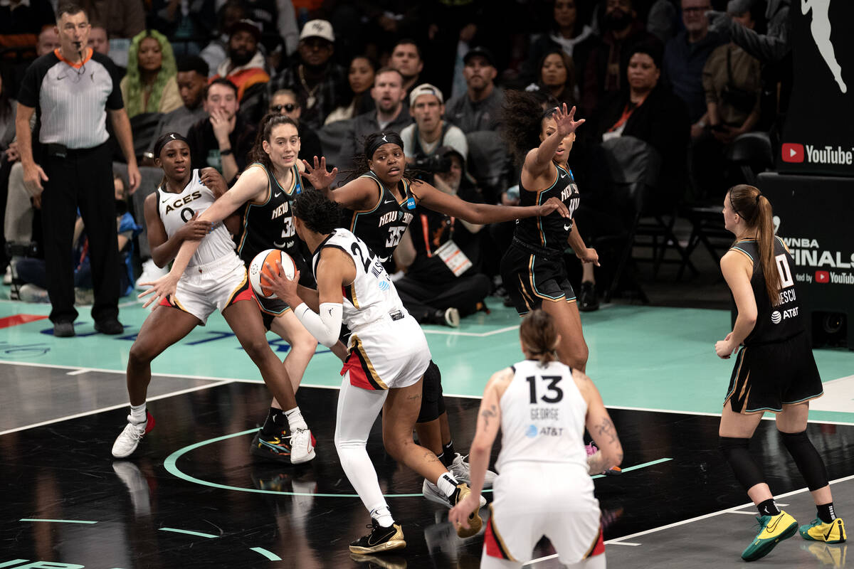 New York Liberty forward Jonquel Jones (35) guards Las Vegas Aces forward A'ja Wilson (22) whil ...