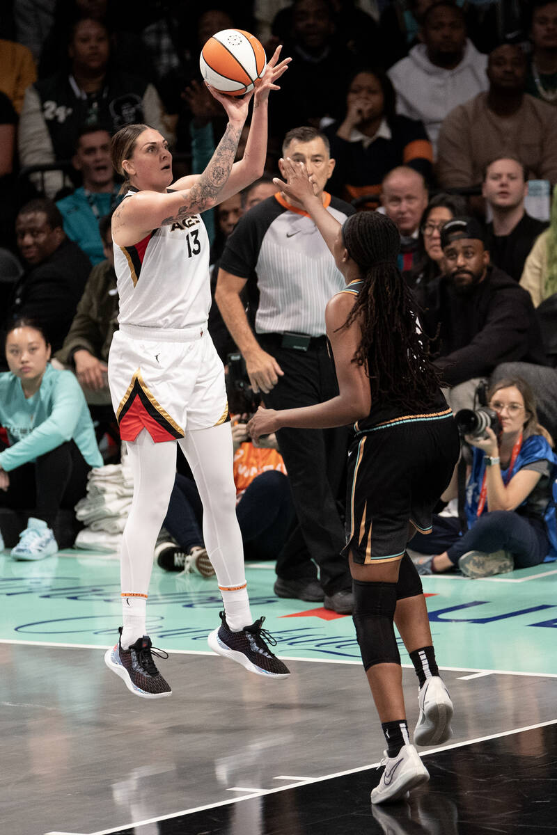 Las Vegas Aces forward Cayla George (13) shoots against New York Liberty forward Jonquel Jones ...