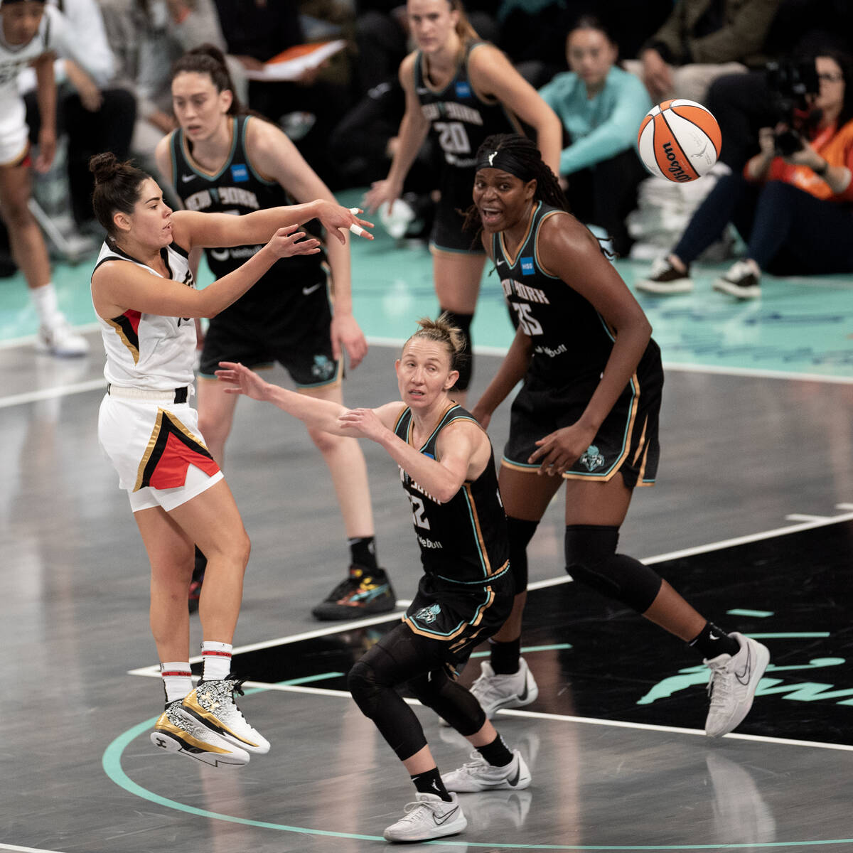 Las Vegas Aces guard Kelsey Plum (10) passes down the court while New York Liberty guard Courtn ...