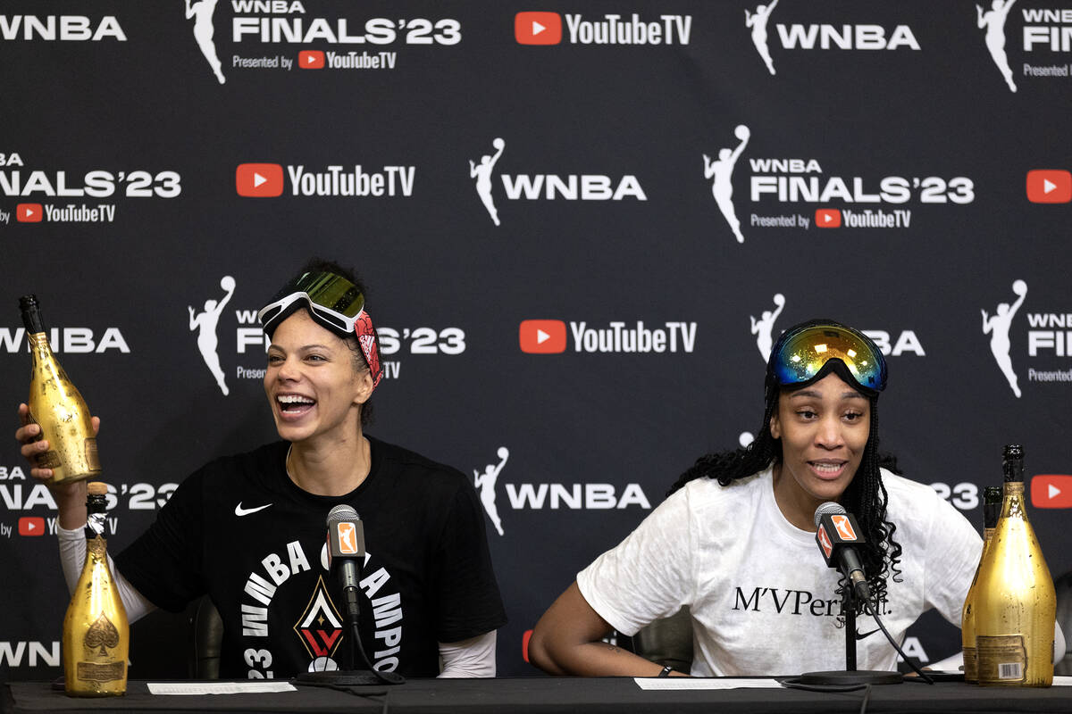 Las Vegas Aces forward Alysha Clark (7) and Las Vegas Aces forward A'ja Wilson (22) speak durin ...