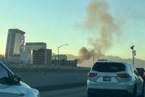 Smoke rises from the scene of a crash on Interstate 515 east of Interstate 15 in downtown Las V ...