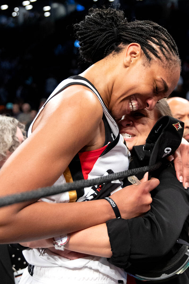 Las Vegas Aces forward A'ja Wilson hugs head coach Becky Hammon after they won Game 4 of a WNBA ...