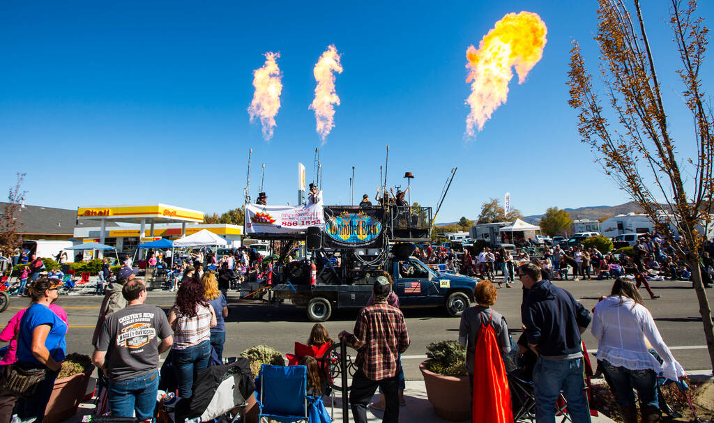 Flames shoot out from the Controlled Burn art car during the annual Nevada Day Parade in Carson ...