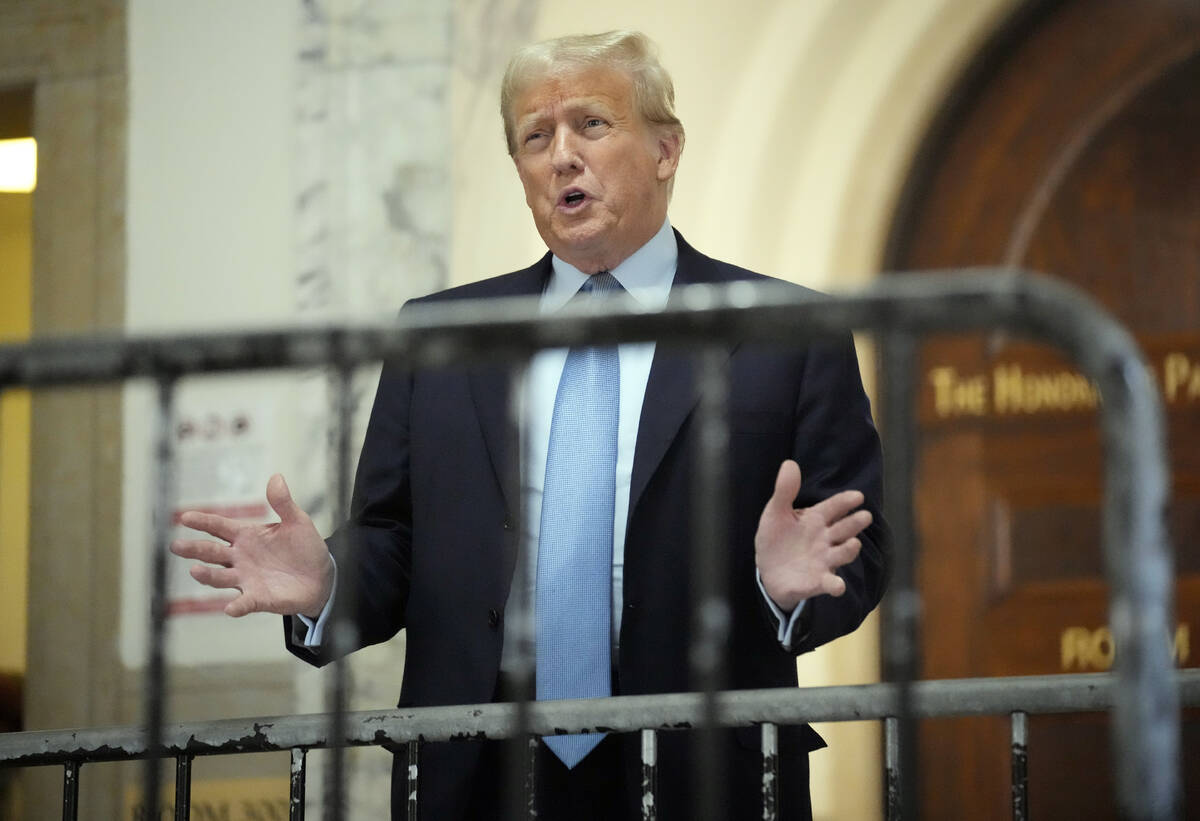 Former President Donald Trump speaks as he returns to the courtroom after the lunch break of hi ...