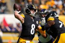 Pittsburgh Steelers quarterback Kenny Pickett throws a pass during an NFL football game against ...
