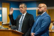Attorney Scott Grubman, right, stands with his client, Kenneth Chesebro as Chesebro is sworn in ...