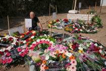 Following the death of Israeli news photographer Roy Edan and his wife Smadar, Edan's father si ...