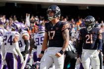 Chicago Bears quarterback Tyson Bagent (17) reacts after his 1-yard rush up the middle for a to ...