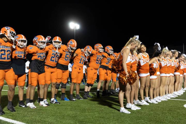 Bishop Gorman players and cheerleaders gather after winning a high school football game against ...