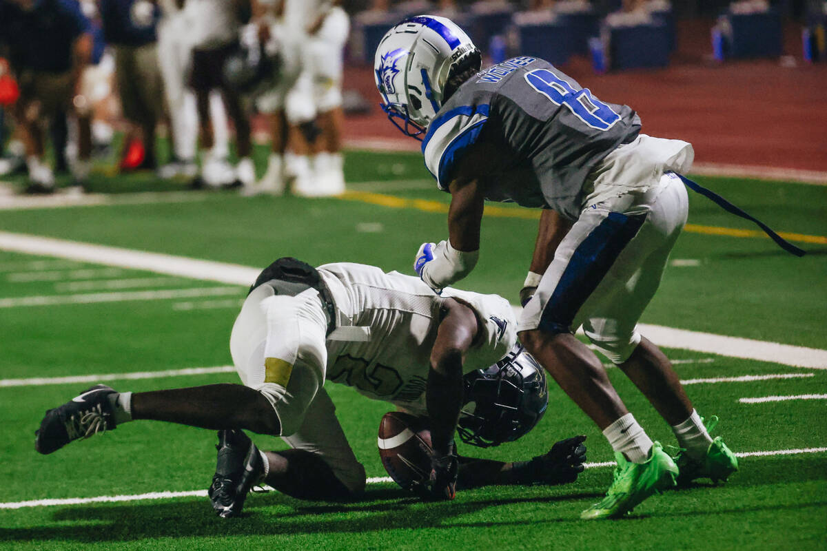 Foothill wide receiver Tarell Mack-Lovely (2) stumbles with the ball during a game against Basi ...