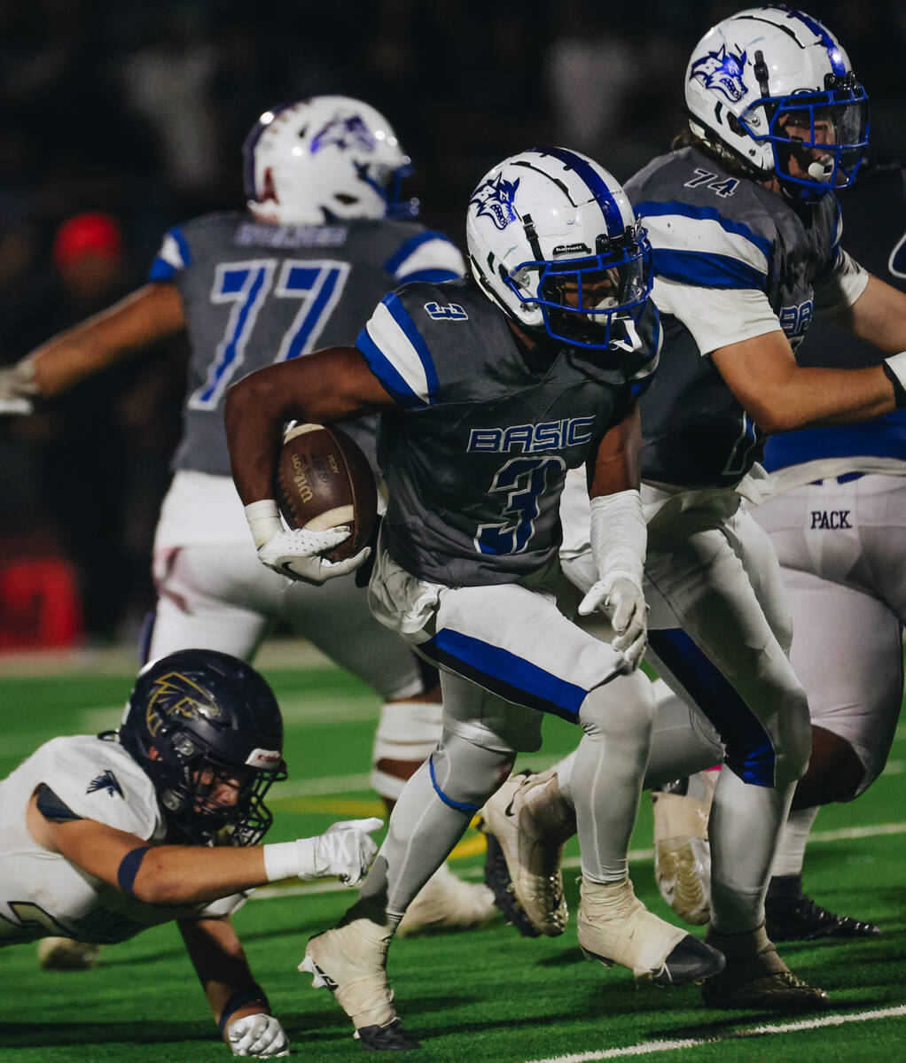 Basic running back Brandon Griffin (3) runs the ball during a game against Foothill at Basic Ac ...