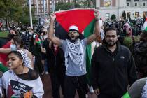 Palestinian supporters chant as they march during a protest at Columbia University, Thursday, O ...