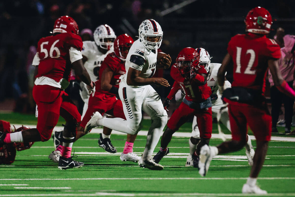 Liberty quarterback Tyrese Smith (11) runs the ball during a game against Arbor View at Arbor V ...