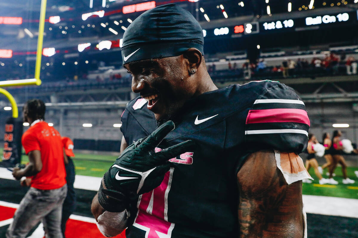 UNLV running back Donavyn Lester (4) celebrates after beating Colorado State and becoming bowl ...