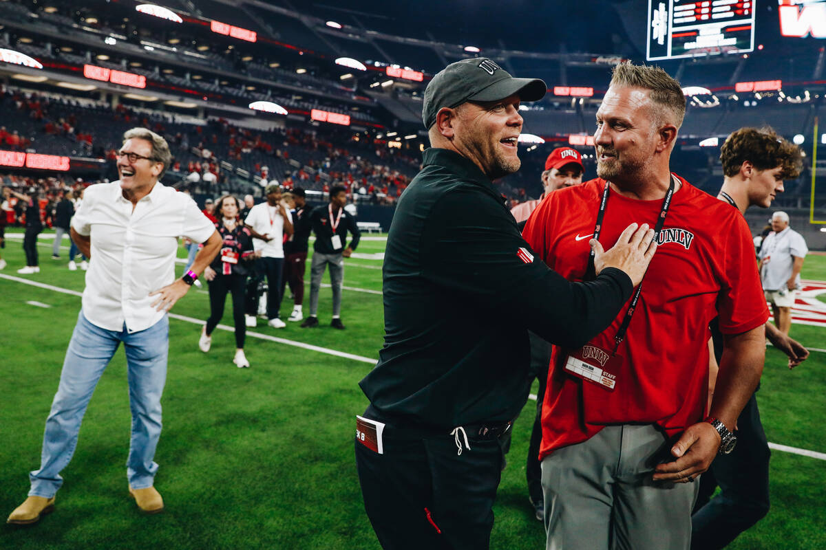UNLV head coach Barry Odom celebrates after beating Colorado State and becoming bowl eligible a ...