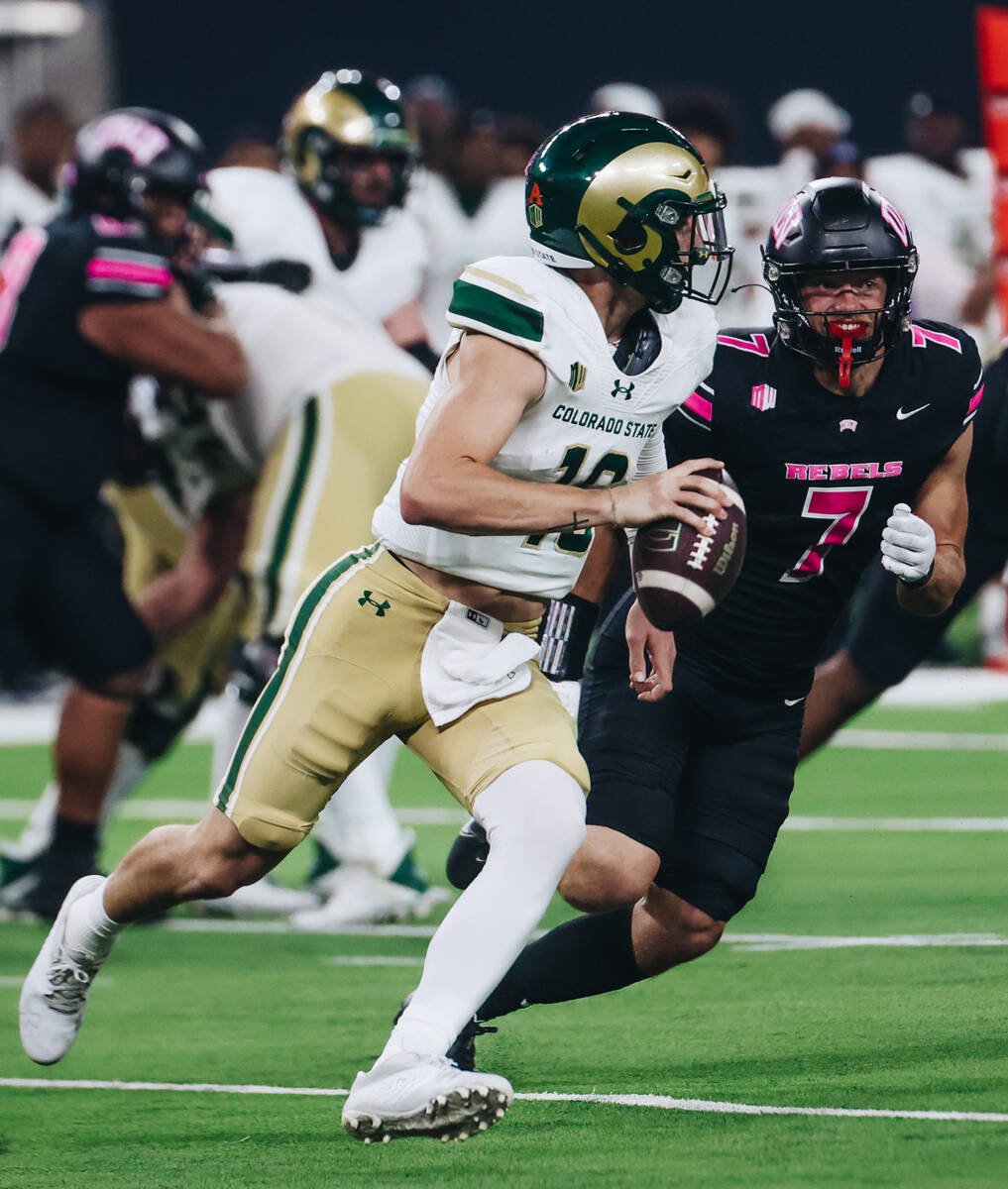UNLV linebacker Jackson Woodard (7) chases down Colorado State quarterback Brayden Fowler-Nicol ...