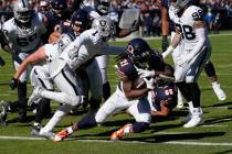 Chicago Bears running back D'Onta Foreman (21) scores a touchdown against the Las Vegas Raiders ...