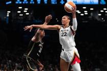 Las Vegas Aces forward A'ja Wilson (22) shoots around New York Liberty forward Jonquel Jones (3 ...