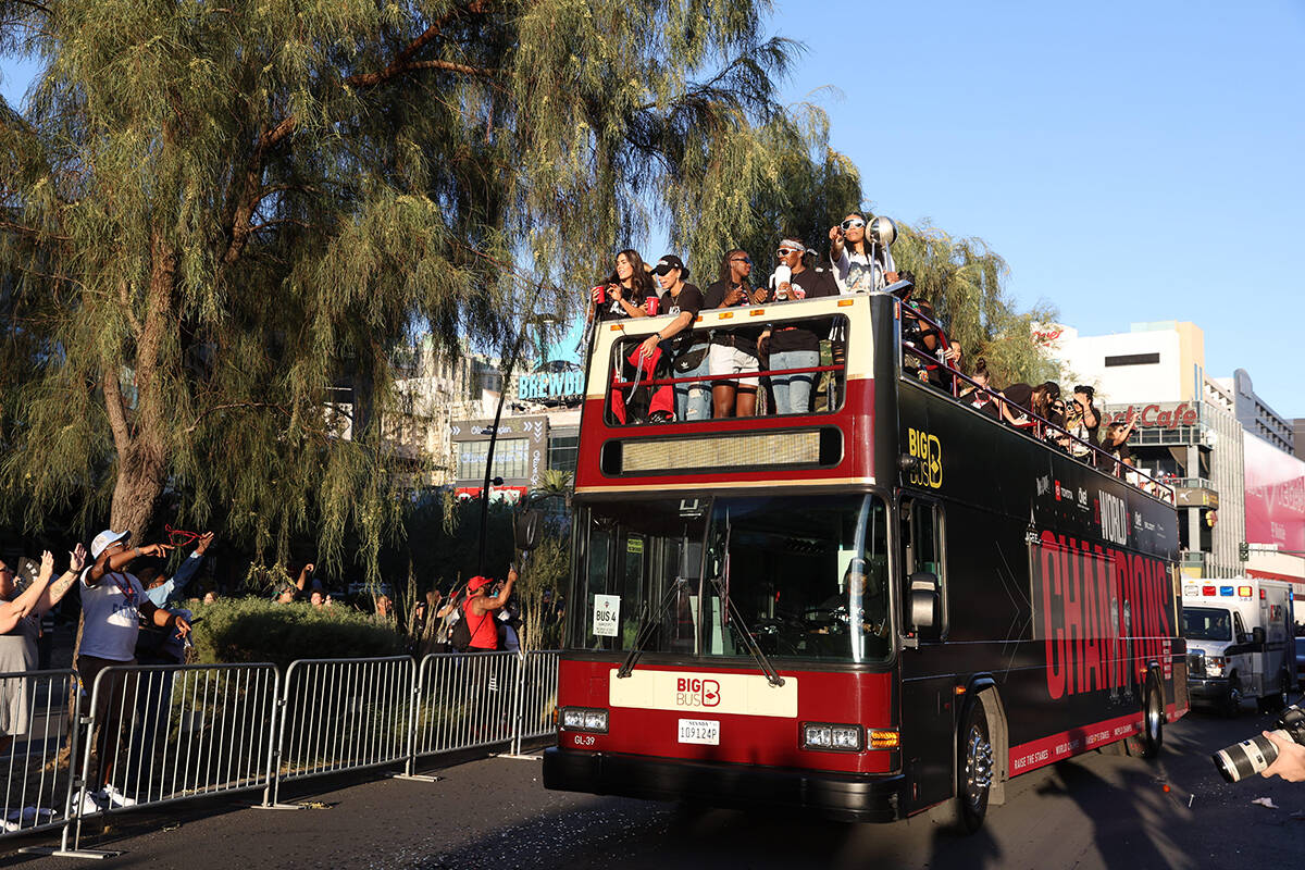The world champion Las Vegas Aces ride a bus as they parade from Tropicana Avenue to Toshiba Pl ...