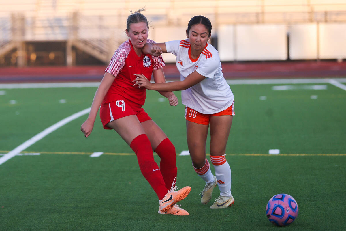 Coronado’s Ryan Neel (9) and Bishop Gorman’s Robyn Dizon (11) chase after the bal ...