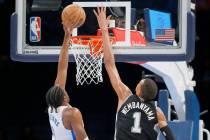 San Antonio Spurs center Victor Wembanyama (1) goes up to block the shot of Oklahoma City Thund ...