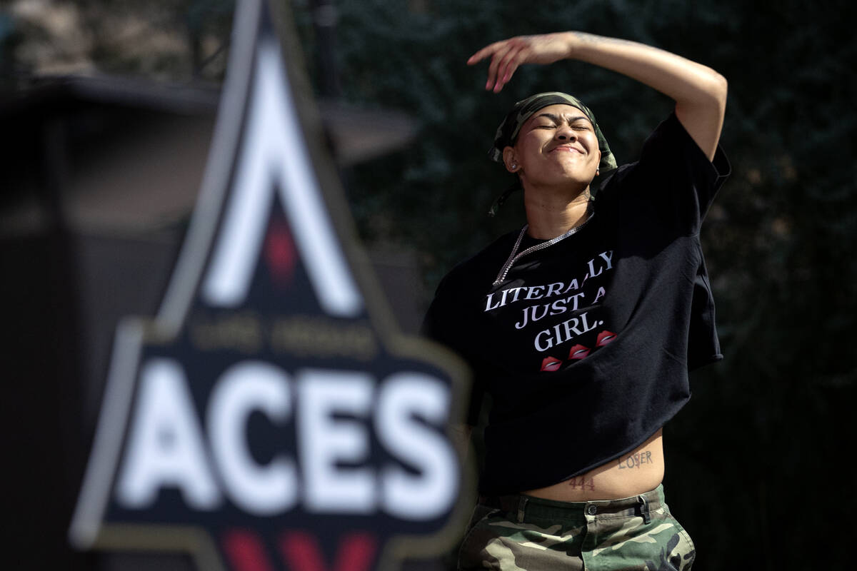 Las Vegas Aces guard Kierstan Bell (1) takes the stage for her team’s celebration of the ...