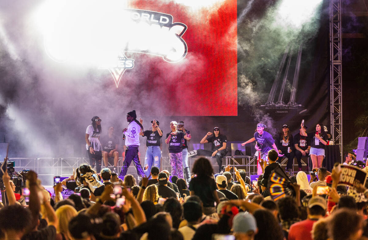 Aces players dance on stage as rapper 2 Chainz performs during their championship celebration ...