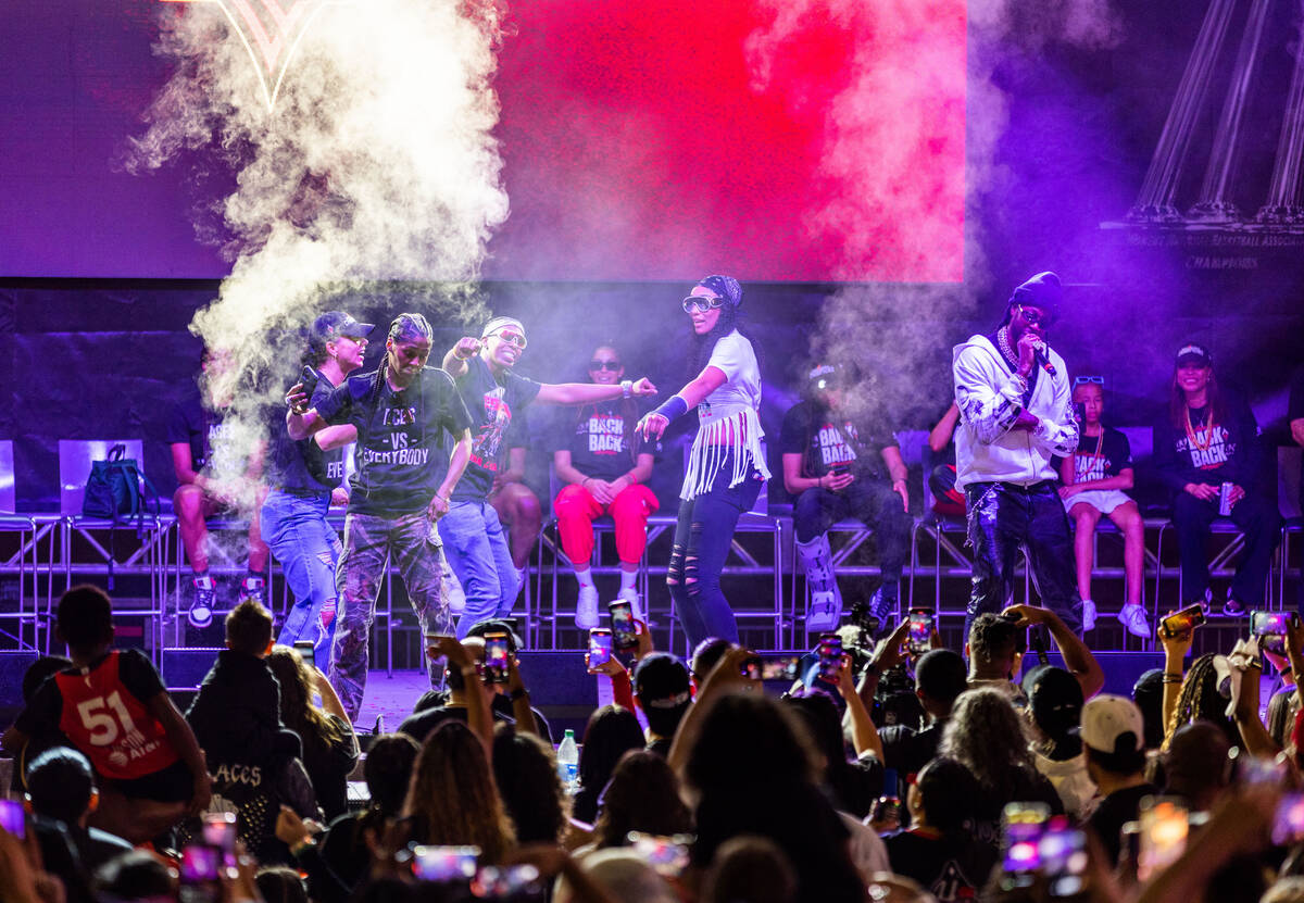 Aces players dance on stage as rapper 2 Chainz performs during their championship celebration ...