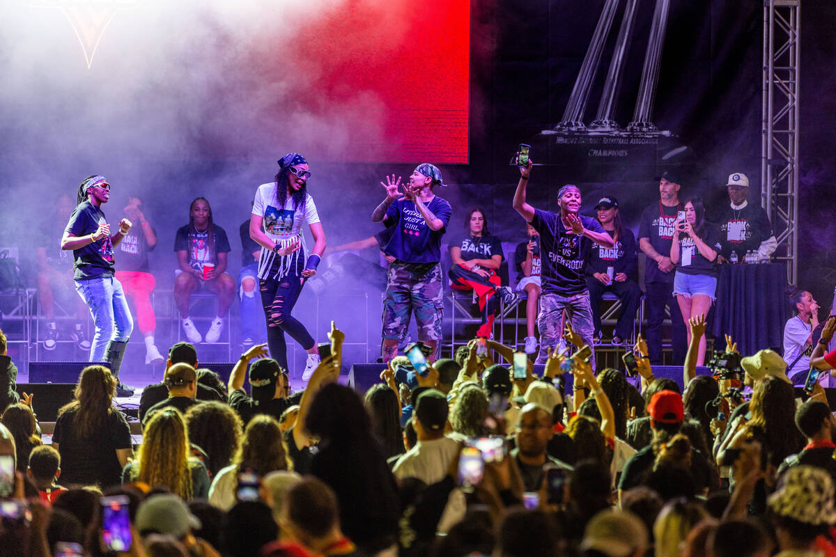 Aces players dance on stage as rapper 2 Chainz performs during their championship celebration ...