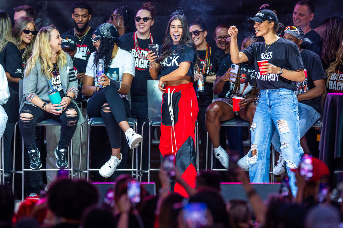 Aces players laugh with Head Coach Becky Hammon during their championship celebration at Toshib ...