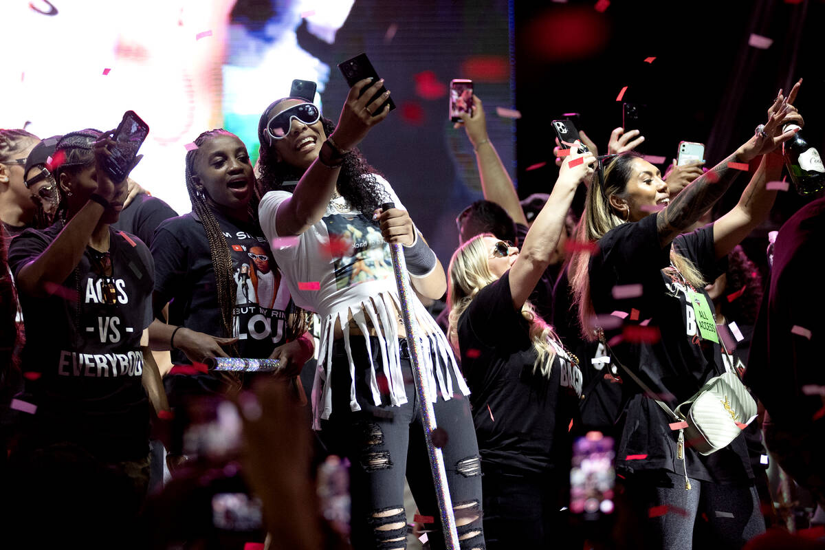The Las Vegas Aces shower the crowd with confetti during a celebration of their WNBA basketball ...