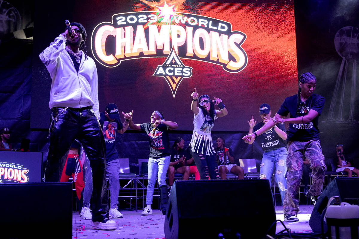 The Las Vegas Aces dance on stage with 2Chainz performance during a celebration of their WNBA b ...