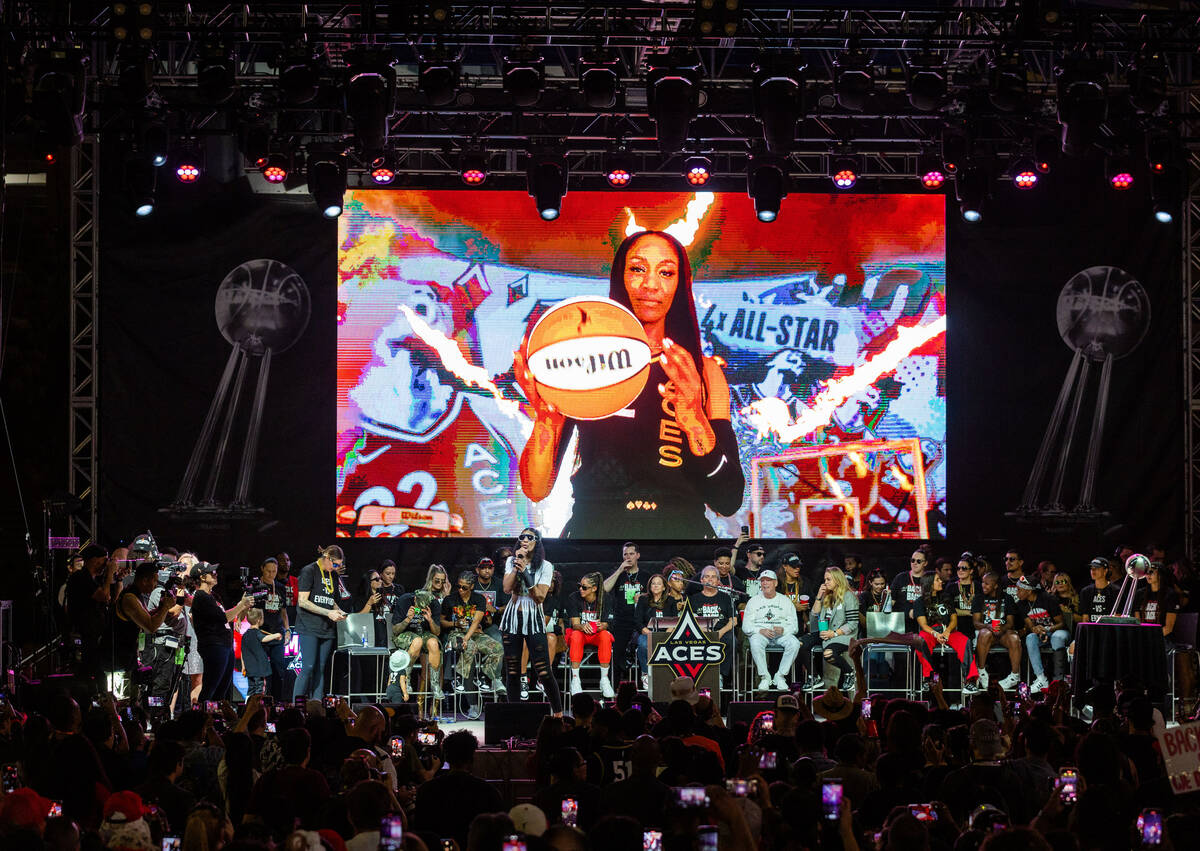 Aces player A’ja Wilson speaks on the stage during their championship celebration at Tos ...