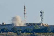 Smoke rises from inside an Israeli army position which was hit by Hezbollah fighters as seen fr ...