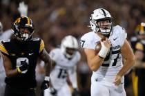 Michigan State linebacker Cal Haladay (27) runs from Iowa wide receiver Diante Vines (0) while ...