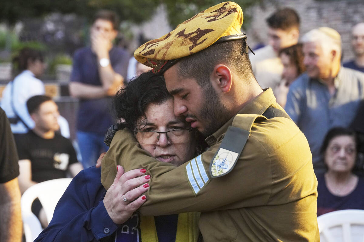 Friends and relatives of Ilai Bar Sade mourn during his funeral at the military cemetery in Tel ...