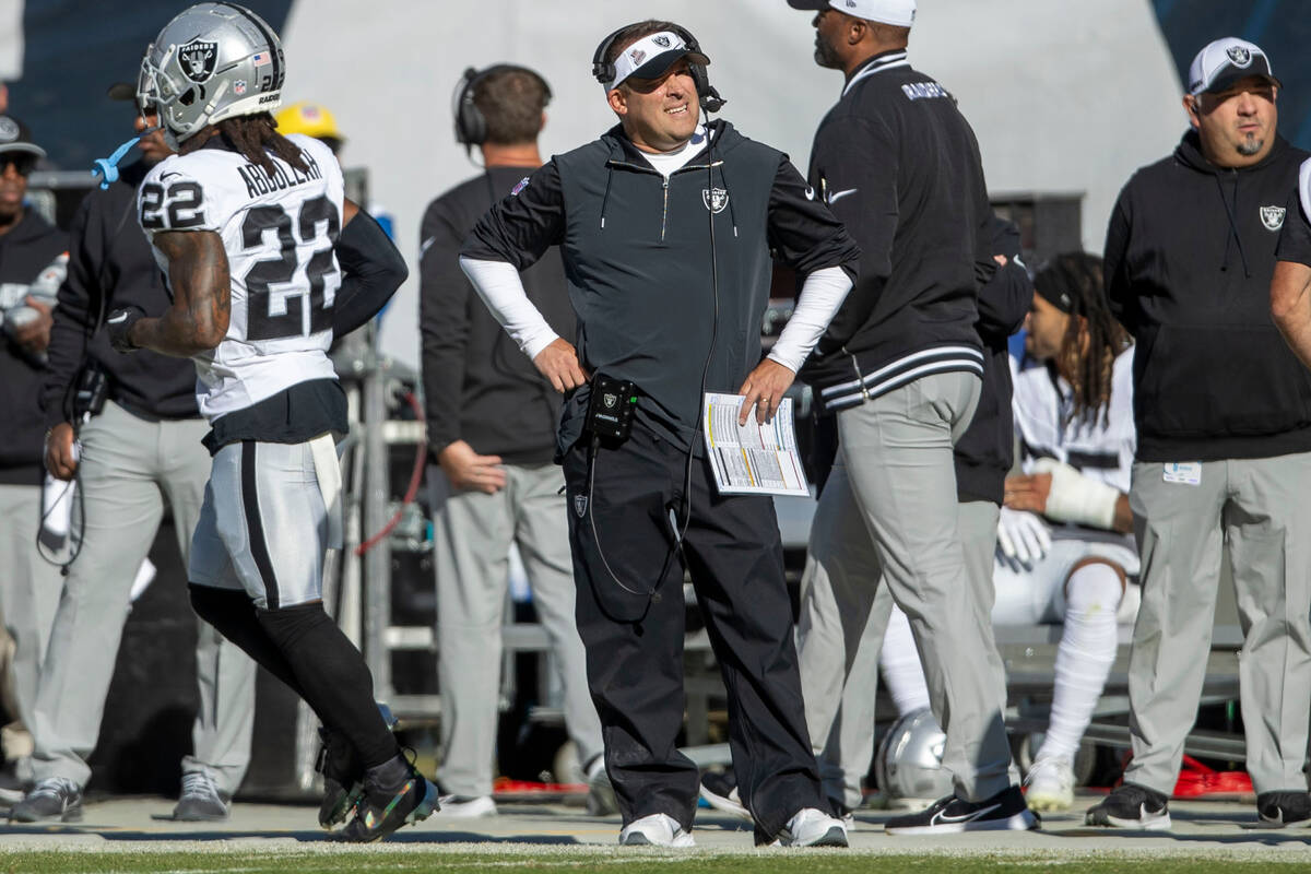 Raiders head coach Josh McDaniels looks to the replay screen after the team fails to convert a ...