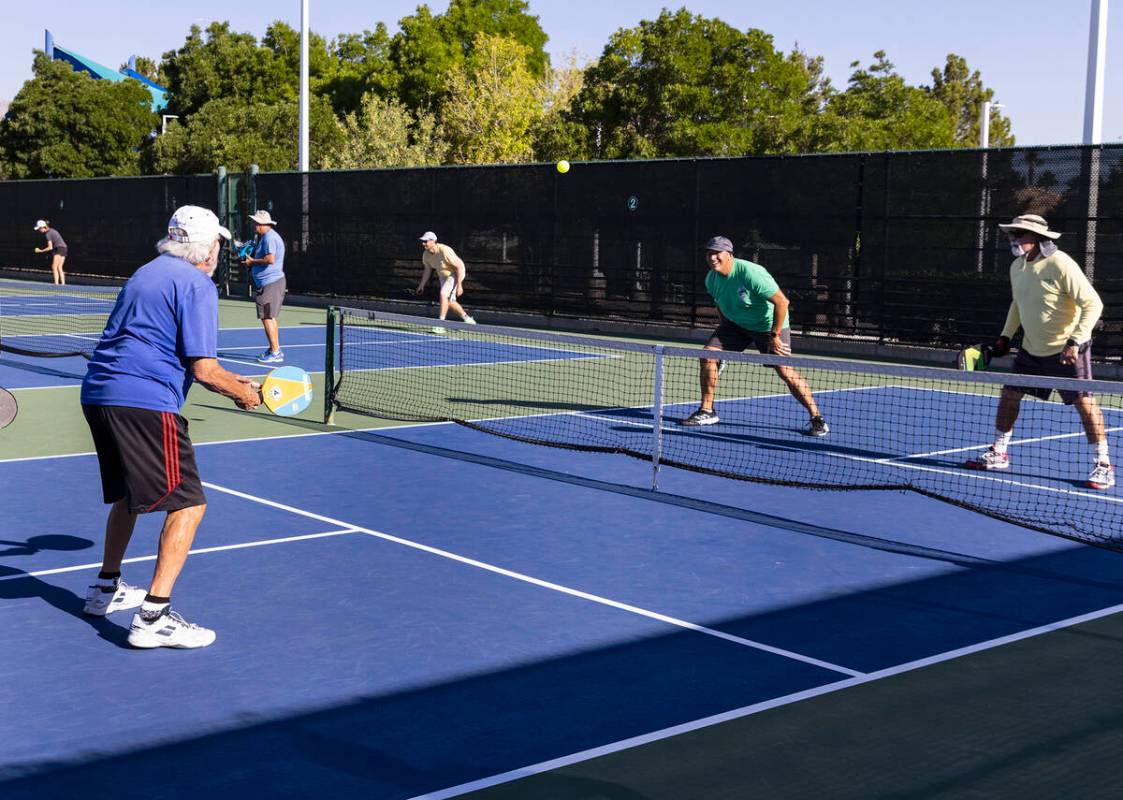 People play pickleball at at Durango Hills Park, on Friday, June 30, 2023, in Las Vegas. (Bizua ...
