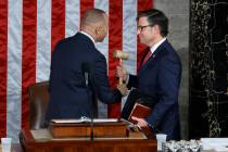 House Minority Leader Hakeem Jeffries, D-N.Y., left, hands the gavel to newly elected Speaker o ...