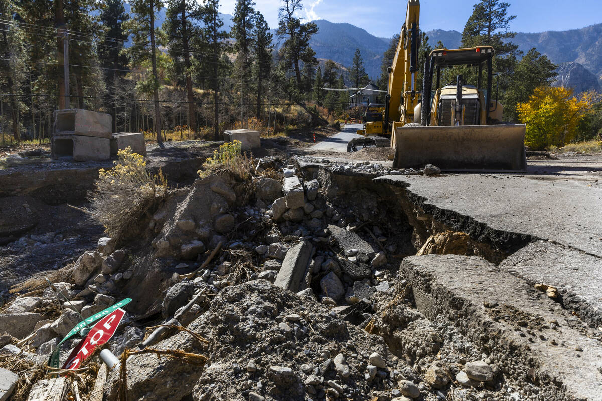 A main road into the Rainbow Canyon subdivision is still damaged and closed as repairs continue ...
