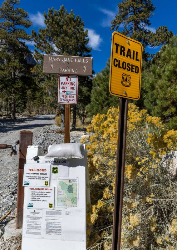 Signs stating that the Mary Jane Falls Trail is closed from the Trail Canyon parking lot as rep ...