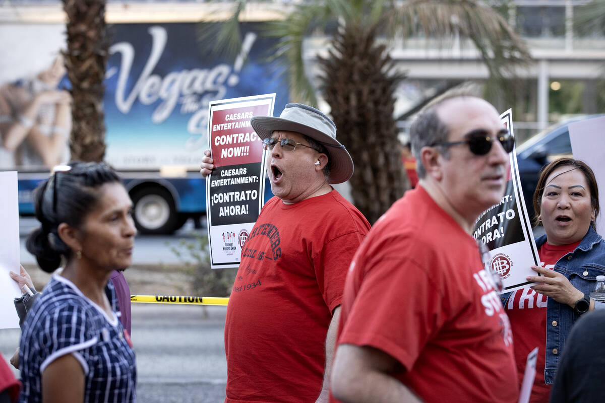 Brent Greenhalgh, center left, a bartender at Flamingo, chants with fellow culinary union membe ...