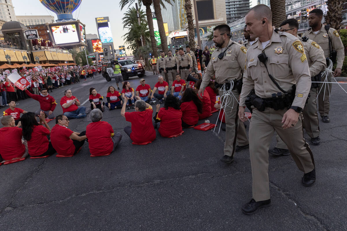 Metropolitan police move in to arrest culinary union members as they block traffic on Las Vegas ...