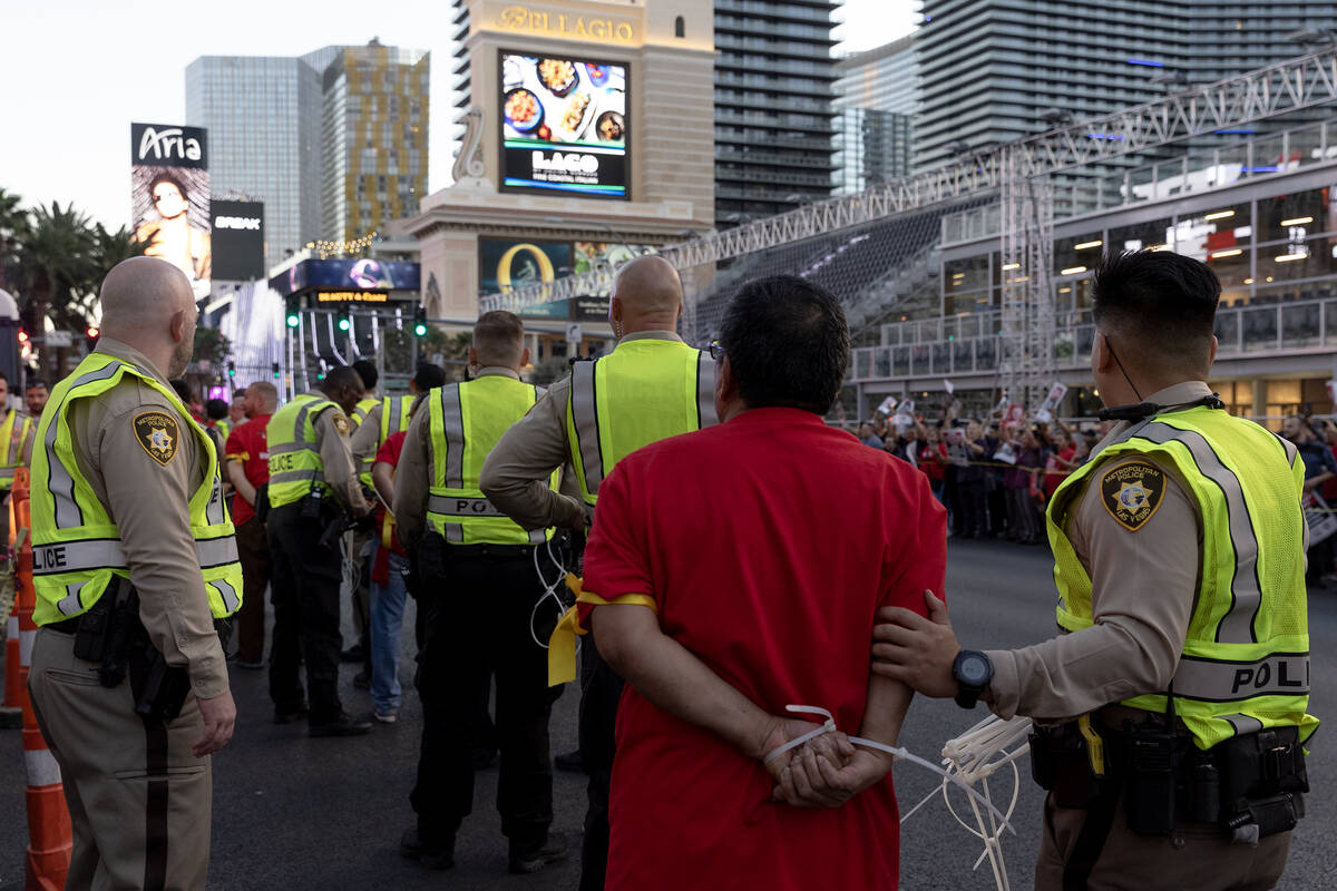 Metropolitan police arrest culinary union members as they protest along Las Vegas Boulevard on ...