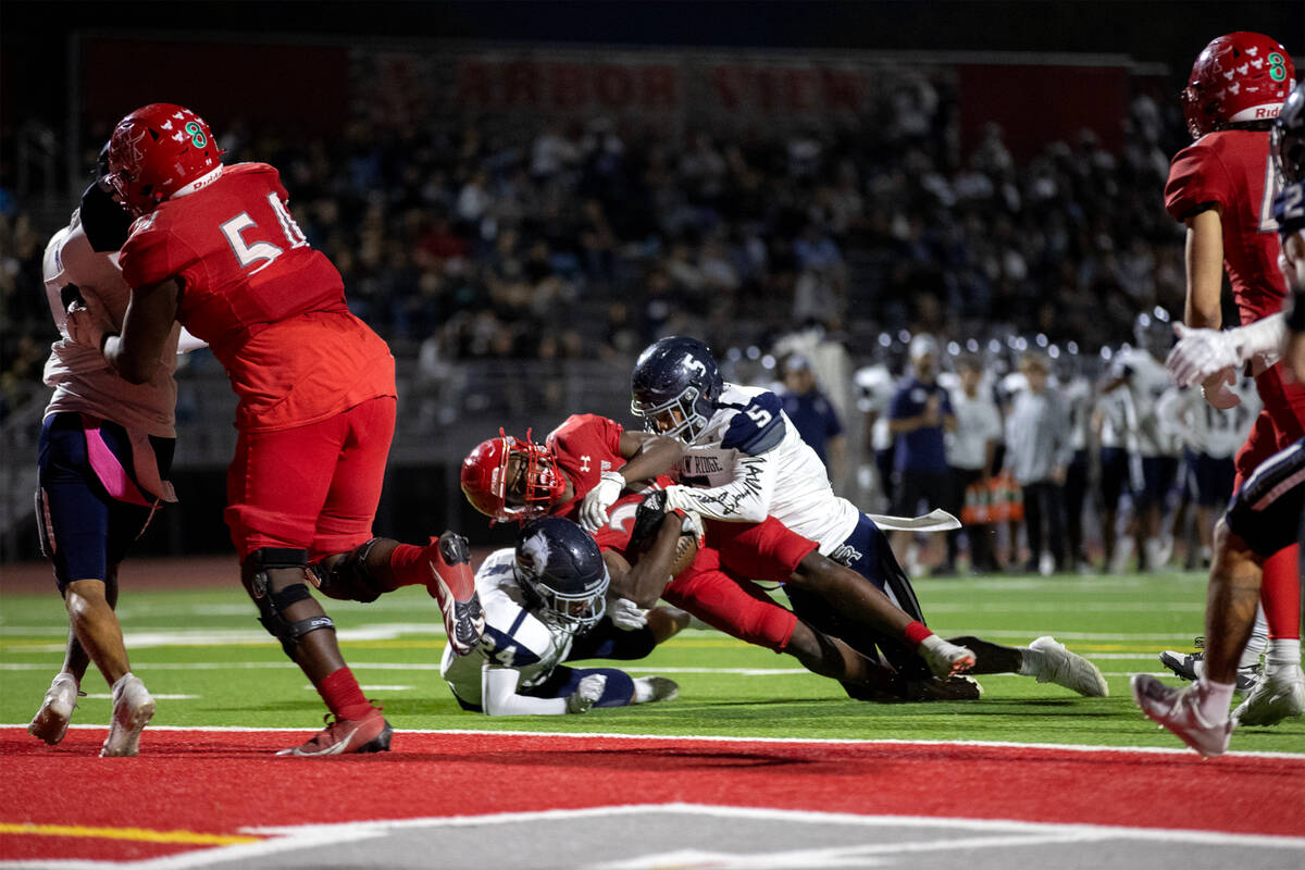 Arbor View running back Kamareion Bell (20) is tackled just short of the end zone by Shadow Rid ...