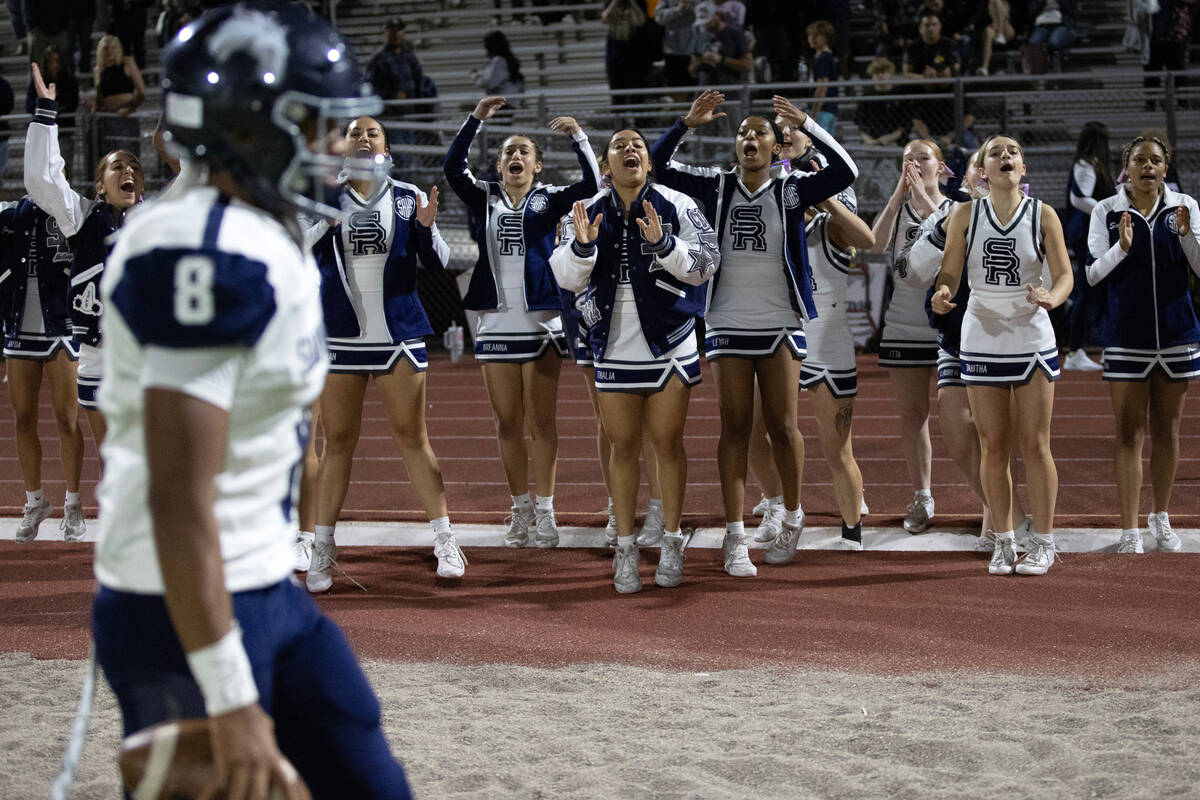 Shadow Ridge cheerleaders celebrate after their team won a high school football playoff game ag ...