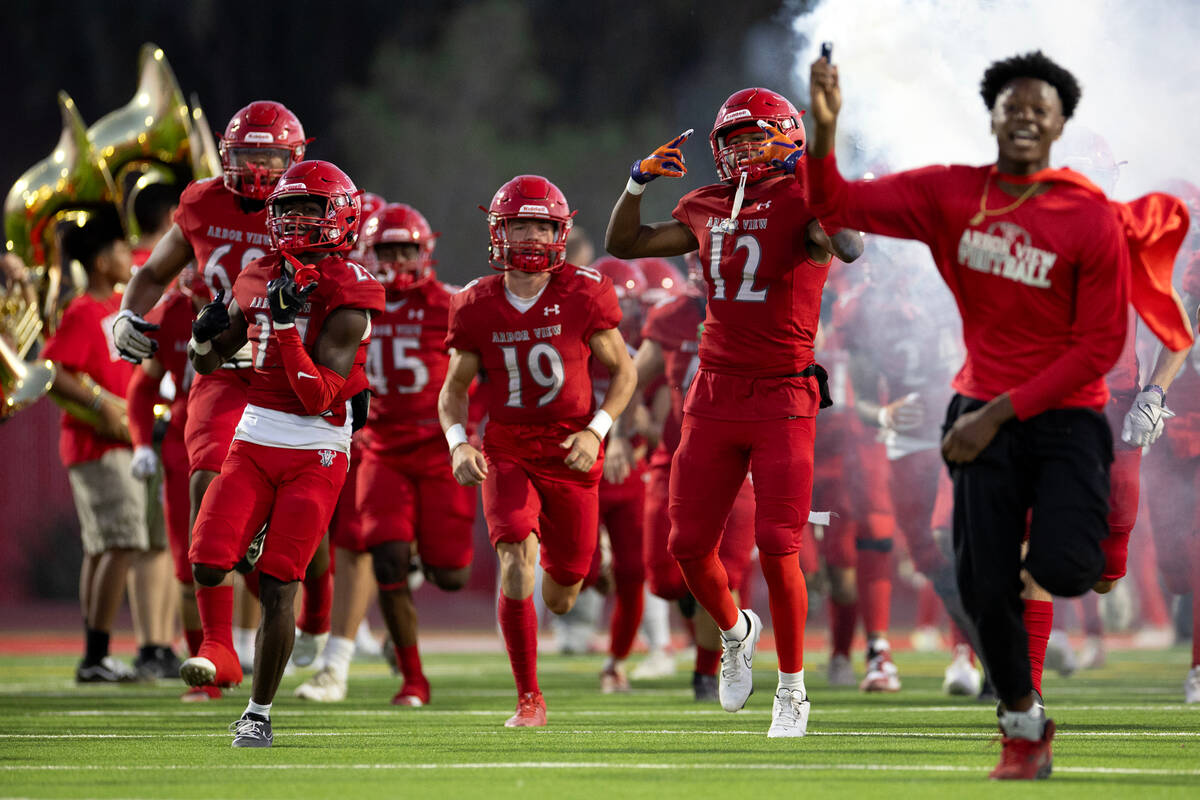 Arbor View takes the field for their high school football playoff game against Shadow Ridge at ...