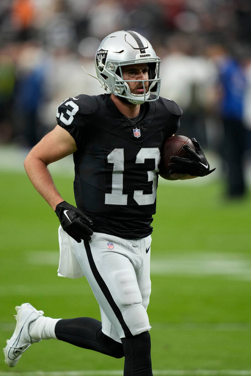 Las Vegas Raiders wide receiver Hunter Renfrow (13) warms up before an NFL football game agains ...