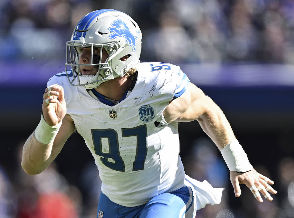 Detroit Lions defensive end Aidan Hutchinson (97) in action during the first half of an NFL foo ...